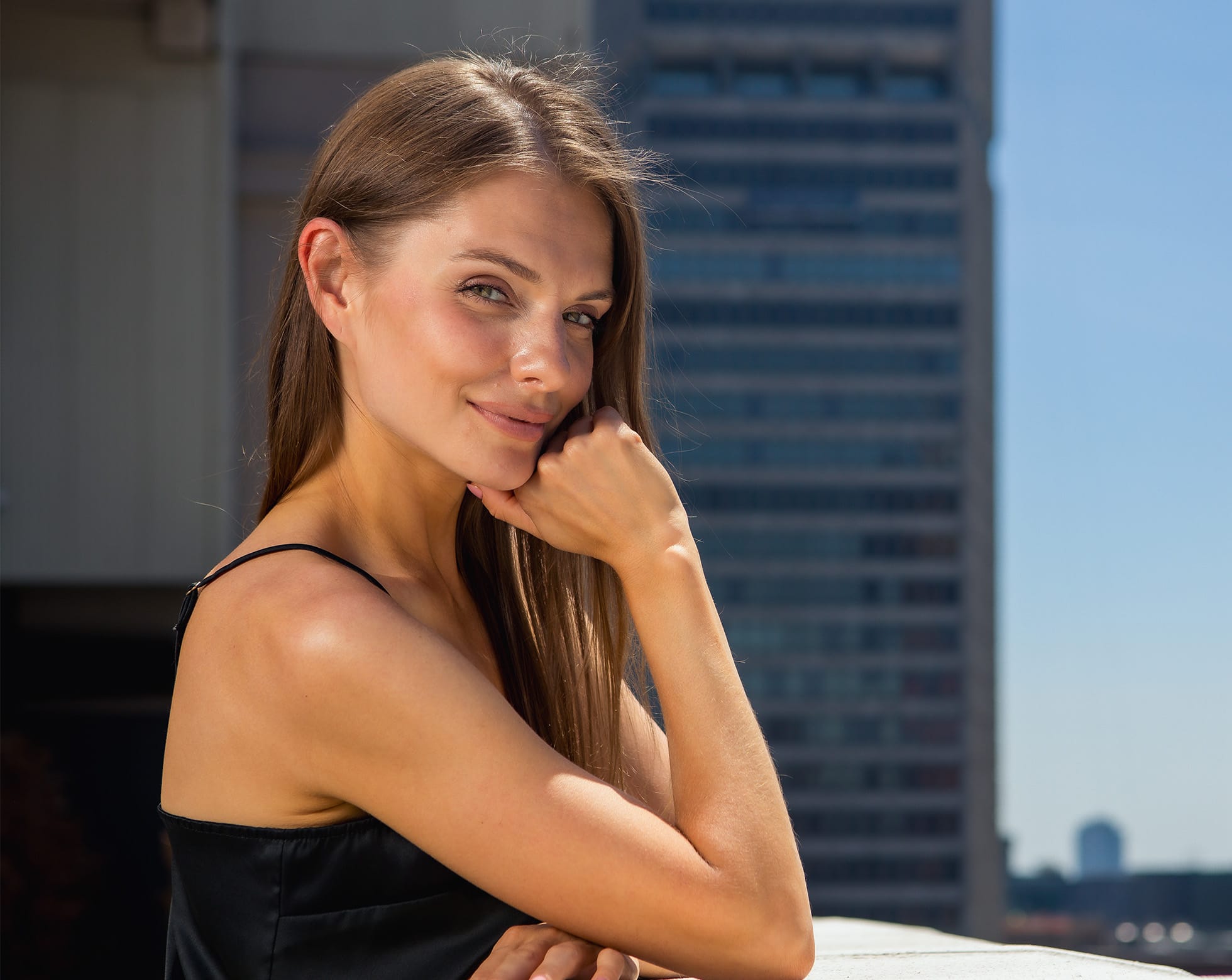 woman resting her face on her hand